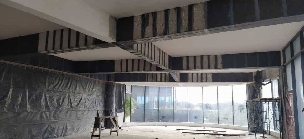 Fiber Laminates and Carbon Fiber Wraps bonded onto the RC Beams using Epoxy Resin Fiber Laminates and Carbon Fiber Wraps bonded onto the RC Beams using Epoxy Resin